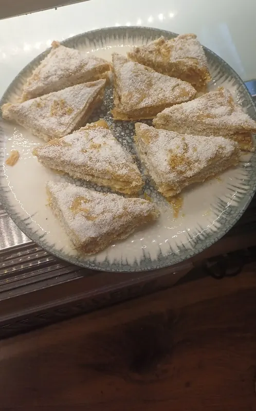 Coconut baklava on a blue-rimmed plate
